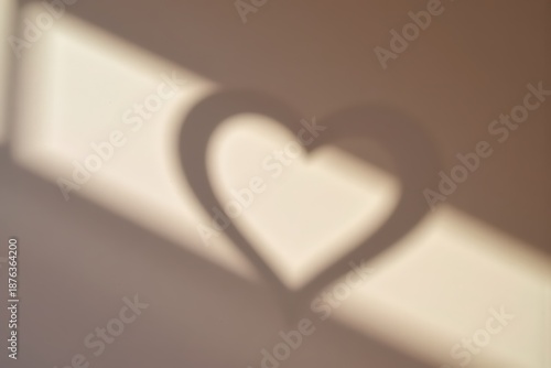 Romantic Heart Shadow Play in Warm Natural Light: Minimalist Valentine's Day Product Background with Copy Space.