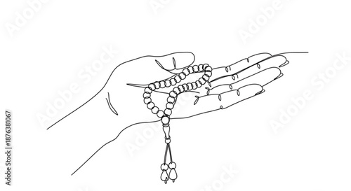 Hand holding prayer beads in a meditative pose  