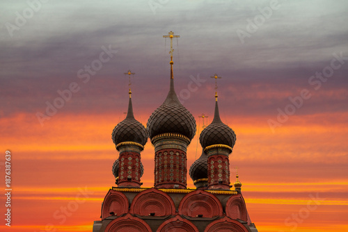 Orthodox church domes silhouette at dramatic sunset sky
