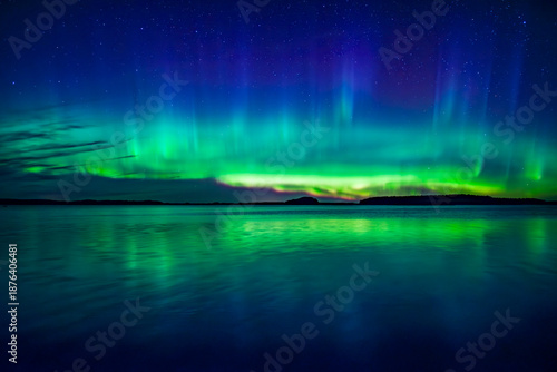Wallpaper Mural Northern lights dancing over calm lake in north of Sweden. Torontodigital.ca