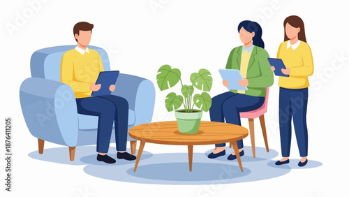 A man sits in a blue armchair while two women stand and sit nearby, all holding tablets