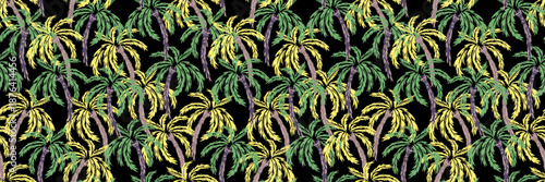 Seamless tropical palm tree vector pattern with green and yellow leaves on a deep black background. Exotic jungle illustration perfect for fabric, wallpaper, summer and resort designs