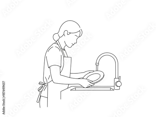 Woman washing dishes in a kitchen sink with a plate