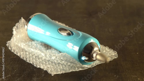 Portable stone attachment rotates on a grinder spin video with sound.