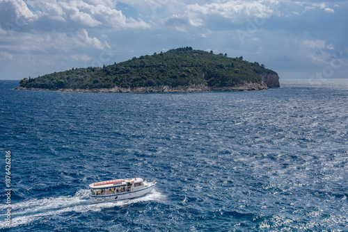Lokrum Island surrounded by the deep blue Adriatic Sea near Dubrovnik, Croatia, in sunny summer day