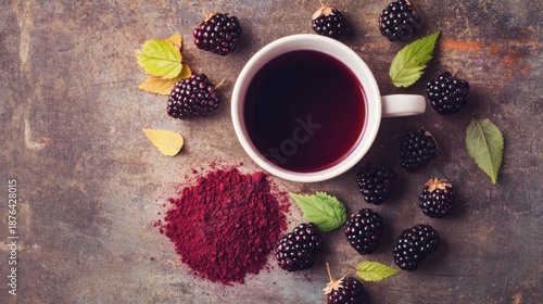 Blackberry tea fresh berries and powder overhead view