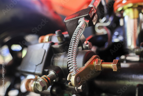 Obraz na płótnie Close up shot of sturdy rear brake pump assembly on modified motorcycle featurin