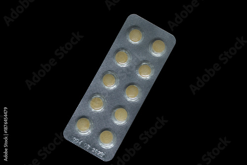 Blister Pack of Tablets on Black Background