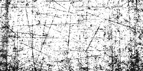 A vintage grungy concrete wall background featuring a rough textured surface with damaged black paint and an old dirty ink pattern design framed by a weathered art border