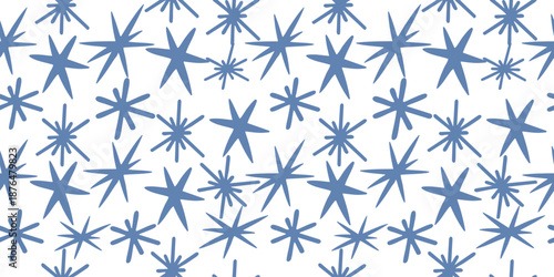Winter starburst snowflake seamless pattern in blue tones