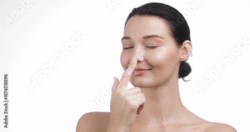 Playful Woman Touching Nose And Smiling In Skincare Beauty Concept