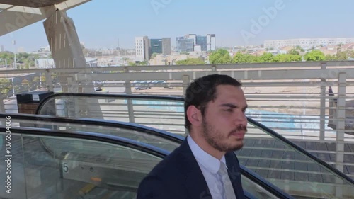 Wallpaper Mural Professional Man Preparing to Use an Escalator on a Modern Bridge Torontodigital.ca