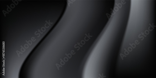 Sandblasted or brushed titanium or steel metal surface, the light reflection of the curved lines creates a smooth gradation on the dark black metallic background