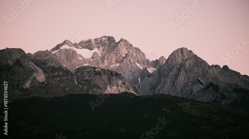 Photos Sunrise Glow on Jade Dragon Snow Mountain over Lijiang Old Town, Yunnan, China