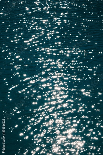 Vibrant sparkling water texture with starburst highlights, perfect for summer or luxury background.