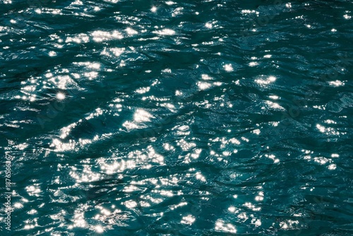 Vibrant sparkling water texture with starburst highlights, perfect for summer or luxury background.