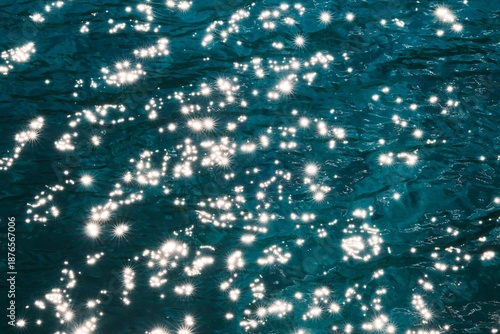 Vibrant sparkling water texture with starburst highlights, perfect for summer or luxury background.