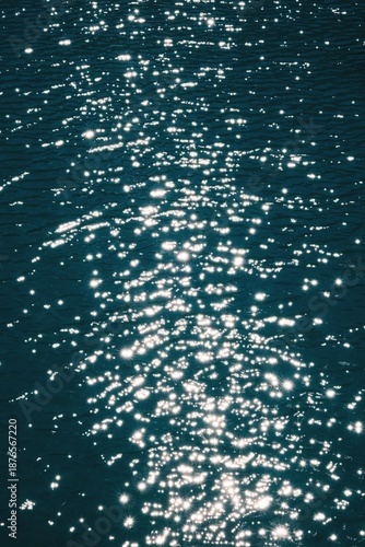 Vibrant sparkling water texture with starburst highlights, perfect for summer or luxury background.