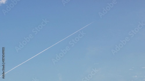 Fighter Jet Smoke Trail in Clear Blue Sky
