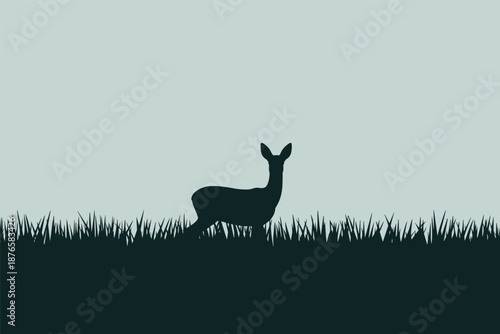 Deer Silhouette in a Peaceful Grassy Meadow, wildlife landscape concept with copy space