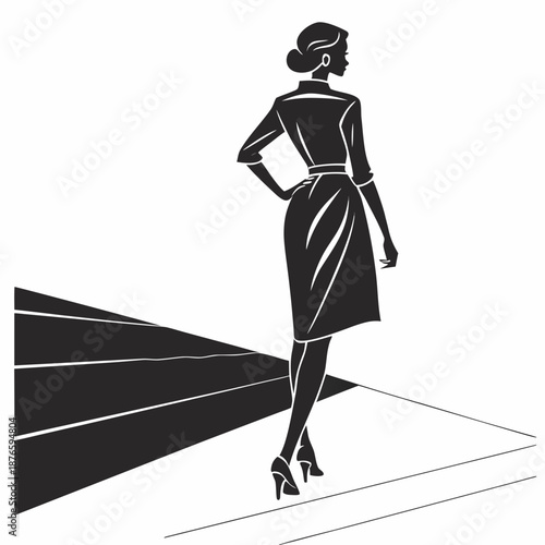Woman in black dress silhouette on runway fashion
