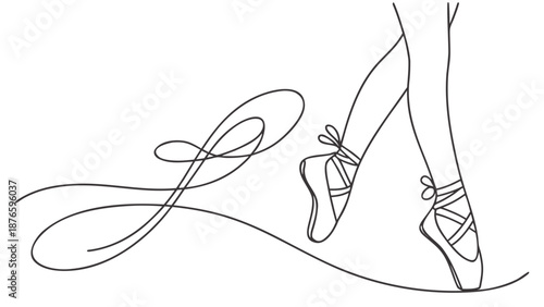 Elegant ballet dancer's feet in pointe shoes gracefully move on a delicate line.