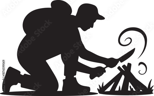 Silhouette of a person lighting a campfire with a match