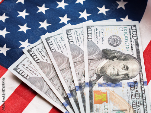 American Dollars on a Background of the U.S. Flag