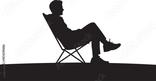 Silhouette of a person sitting on a folding chair with crossed legs
