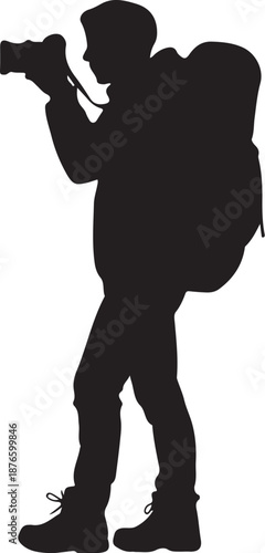 Silhouette of a Person with a Camera and Backpack hiking