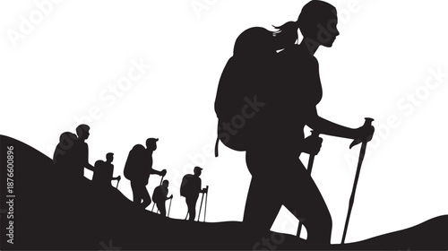 Silhouette of hikers with trekking poles on a mountain trail