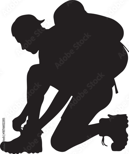 Silhouette of person tying shoelaces with backpack
