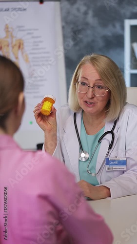 Wallpaper Mural Woman physician prescribing and giving pills to female patient during check-up Torontodigital.ca