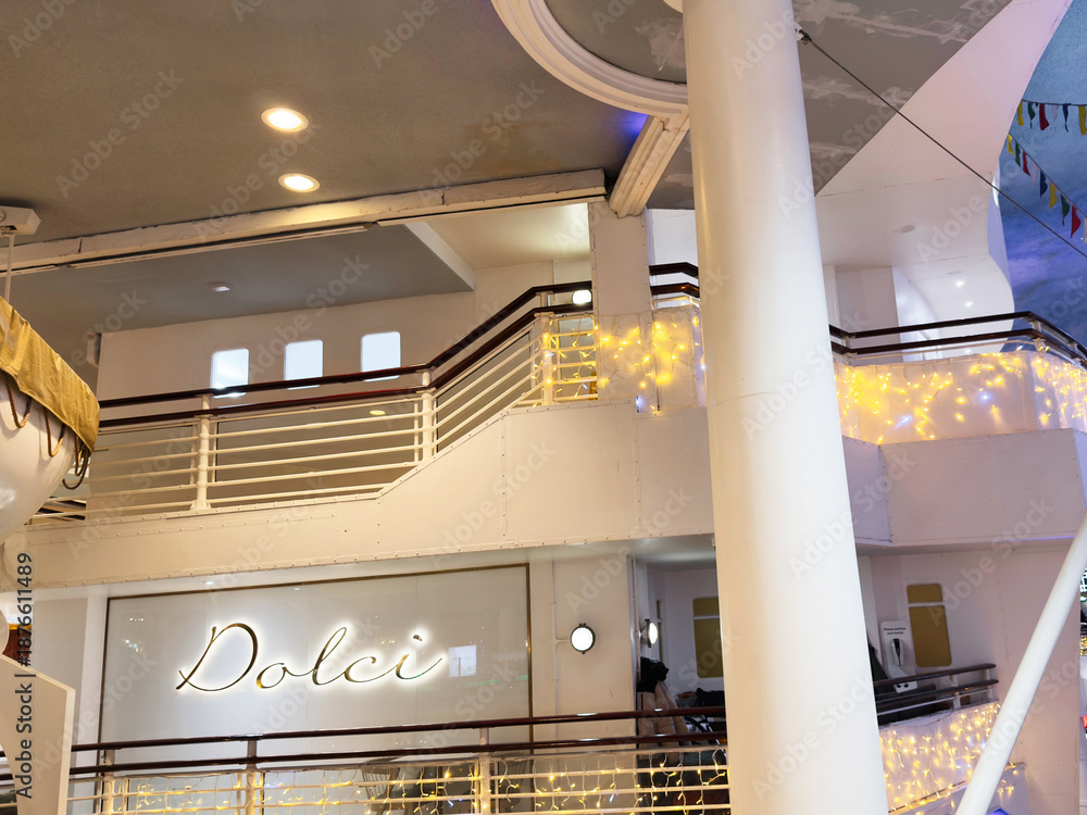 Fototapeta premium Dolci shop interior in Manchester mall with festive lights and nautical decor