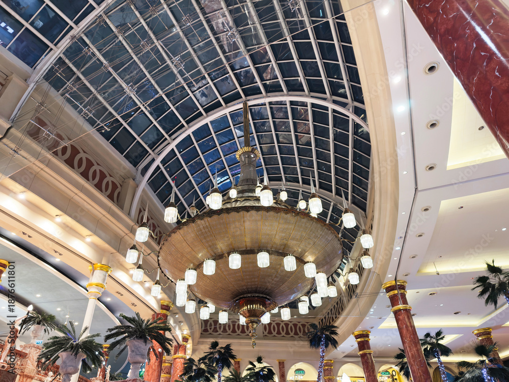 Obraz premium Luxurious interior Trafford Centre with grand chandelier and glass atrium in Manchester UK hotel lobby