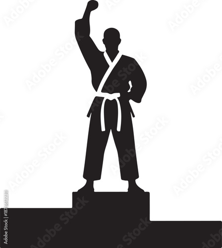 Black silhouette statue of karate practitioner with raised fist