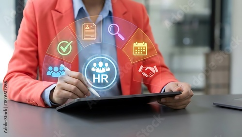 Businesswoman using digital tablet for HR management tasks in modern office