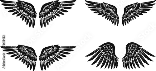 Black silhouette angel wings set in different shapes and styles on white background