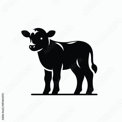 Black silhouette of a cow standing on a plain background