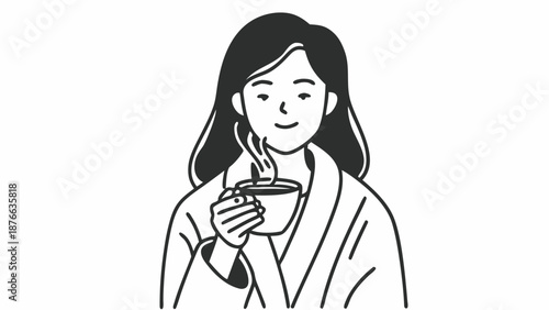 Woman enjoying a warm beverage in a relaxed environment