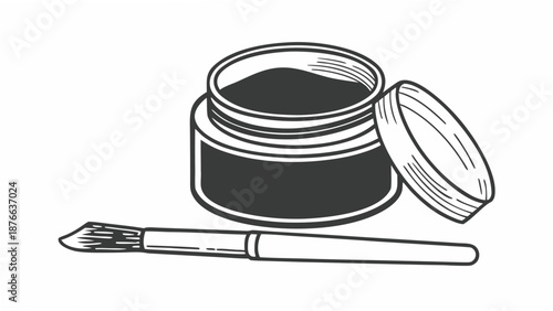 An ink container and brush on a plain white background viewed from the side