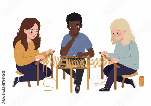 Diverse group of young adults engaged in traditional chair caning or weaving craft, demonstrating handmade artistry and a shared learning experience.