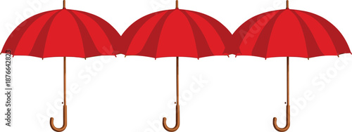 Three red umbrellas with curved wooden handles aligned in a row, classic rain umbrellas isolated on white background