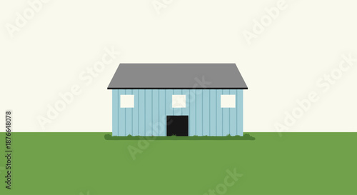 Simple blue wooden barn on a green field with gray roof.