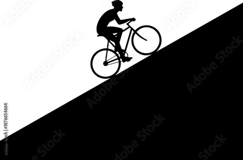 Silhouette of cyclist riding bicycle uphill on steep slope