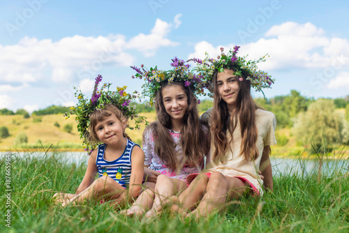 Child wearing a flower crown outdoors. Selective focus.