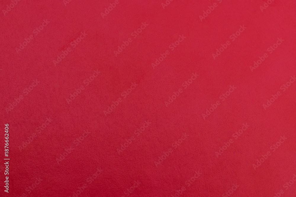Fototapeta premium Red Textured Leather Background - Close-up of Red Synthetic Material Surface,High-resolution macro shot of a vibrant red textured surface. Ideal for luxury backgrounds, leather goods industry,