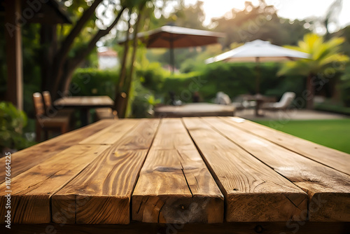 Wooden Plank Table with Rustic Texture and Green Bokeh.