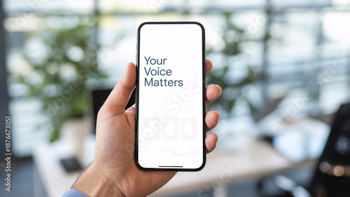 Hand holding smartphone displaying 