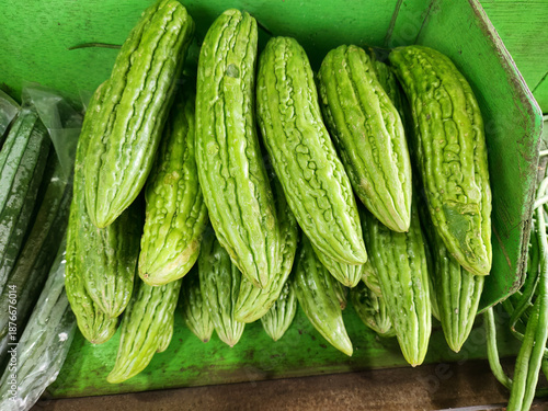 Konstfotografi Closeup bitter melon pile arranged for fresh market retail